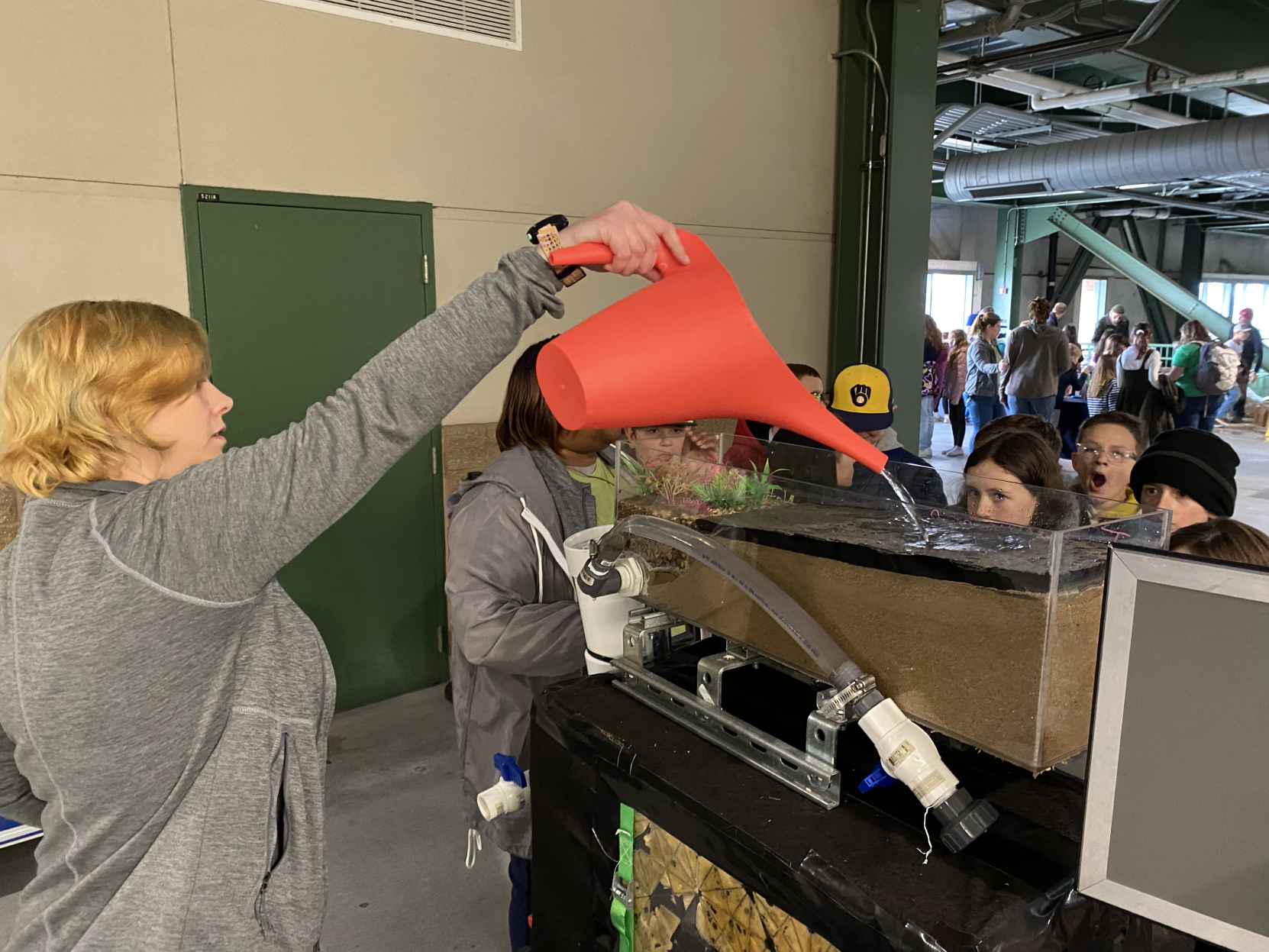 Jasmine Viges pours water